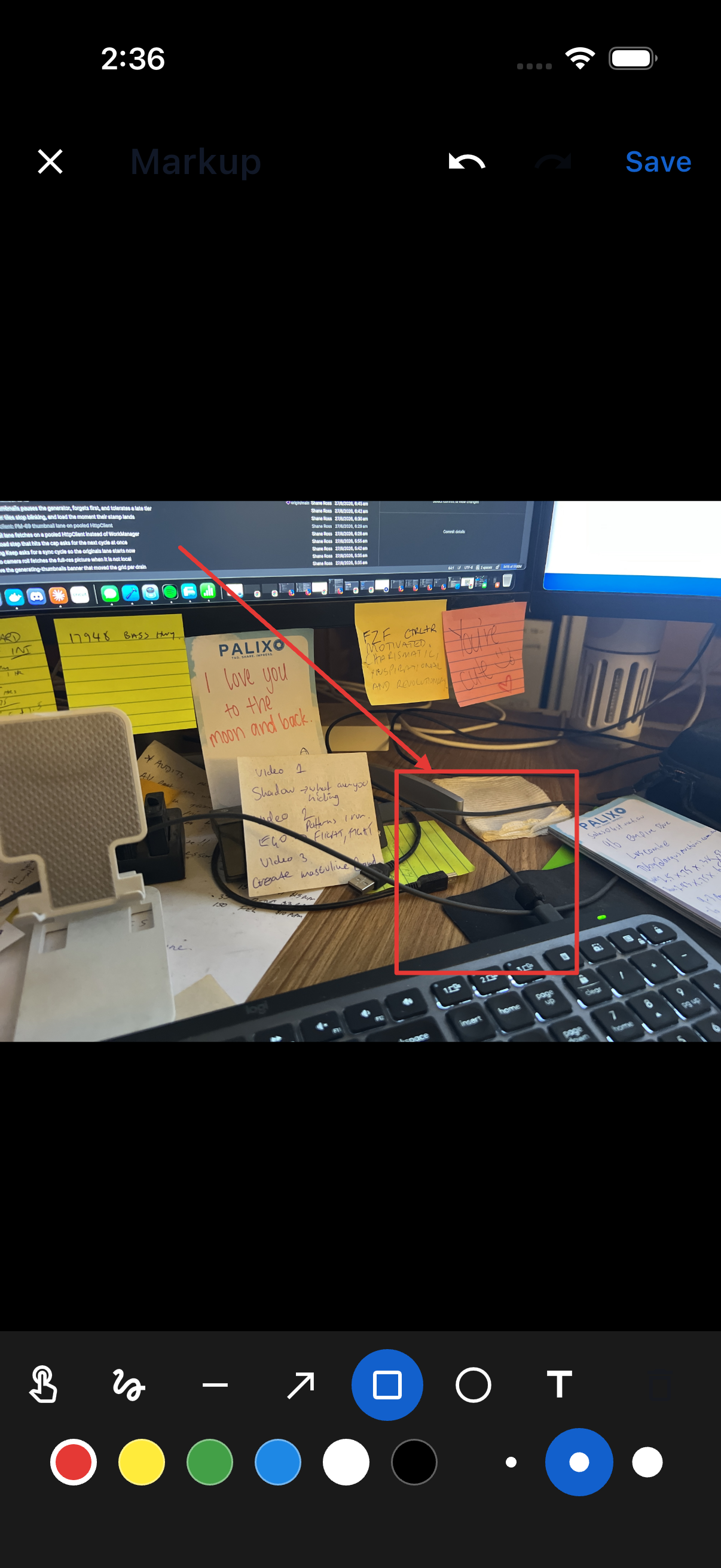The Markup editor with an arrow and text drawn on a photo